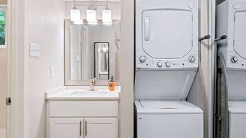 Shower, hair dryer, towels, shampoo