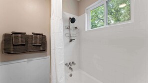 Shower, hair dryer, towels, shampoo