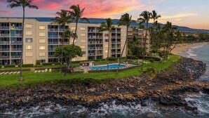 A hotel with multiple floors, a swimming pool, and a beach view. - Royal Mauian, #518^ 3 Bedroom Condo by RedAwning (Kihei)