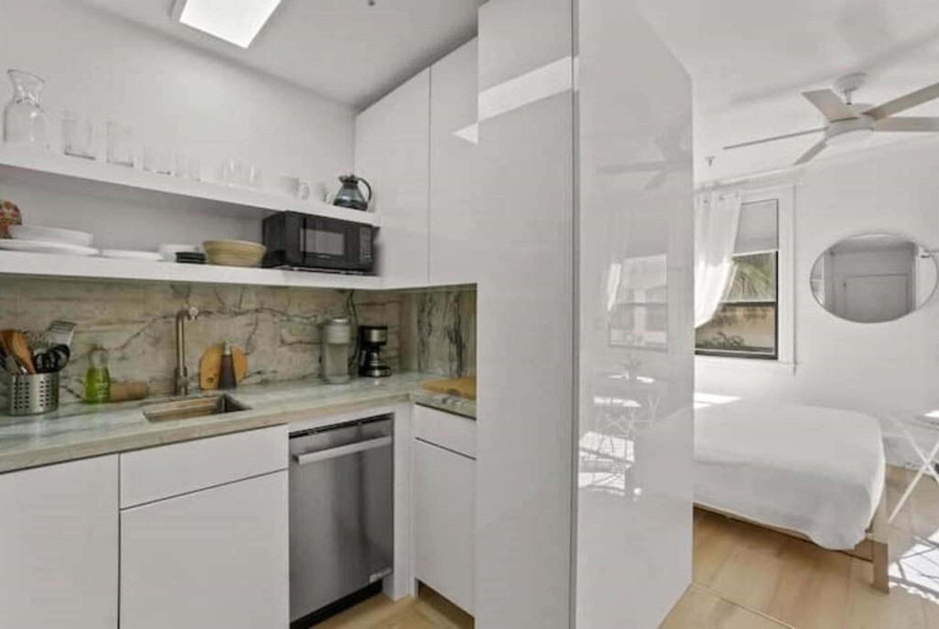 Kitchenette beside open sleeping area