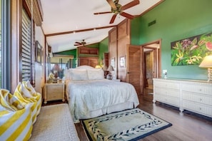 A bedroom with a bed, a bedside table, a lamp, a dresser, and a ceiling fan. - Wailea Elua, #2202 2 Bedroom Condo by RedAwning (Kihei)