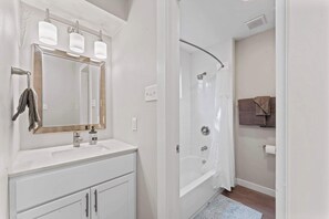 Shower, hair dryer, towels, shampoo