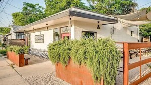 A restaurant with outdoor seating, a covered patio, and a sign that reads "FIGURE8."