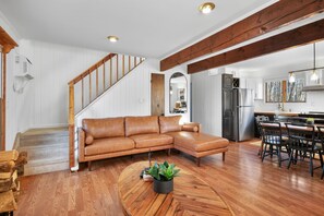 Smart TV, fireplace, books, computer monitors