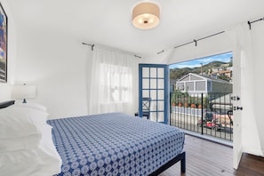 A bedroom with a bed, a window, and a view of the outside. - New! Spacious Detached Home | Perfect Location (Avalon)