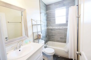 Bathtub, hair dryer, towels