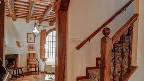 A wooden staircase with patterned steps leading to a landing. - Beach Villa Aralinn by Hello Homes Sitges (Sitges)