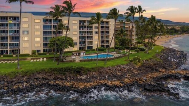 A hotel with multiple floors, a swimming pool, and a beach view. - Royal Mauian, #517 2 Bedroom Condo by RedAwning (Kihei)