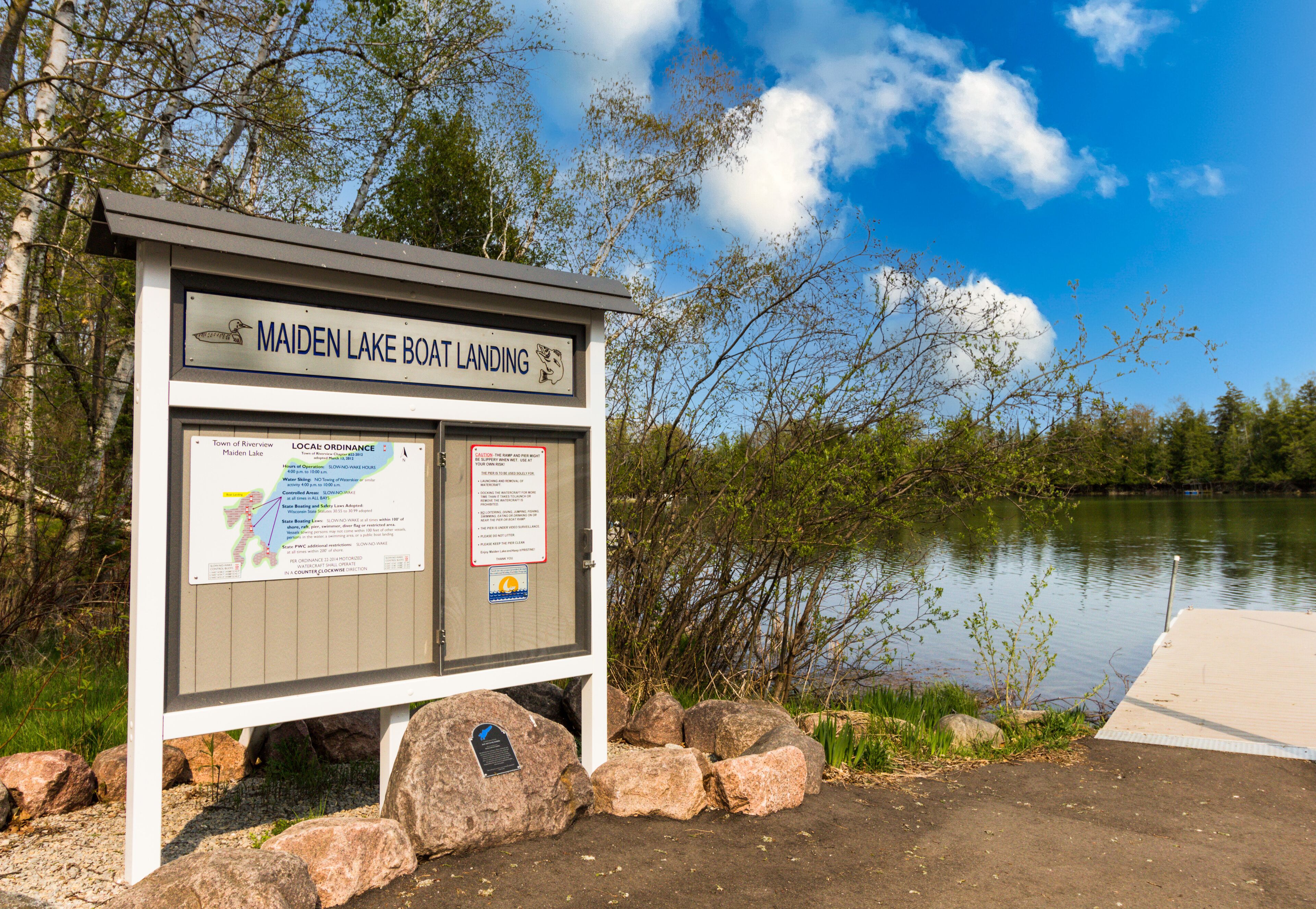 A signboard for Maiden Lake Boat Landing with information about the location and local ordinances.