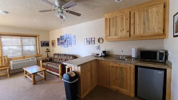 Suite, Multiple Beds | Private kitchenette | Coffee/tea maker