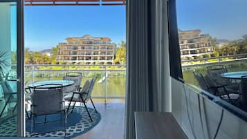 Premium Condo | Living area | 50-inch flat-screen TV with digital channels, TV