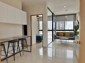 Comfort Loft | Living area | 50-inch plasma TV with digital channels, TV - Soho Apartments (Mazatlán)