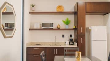 Full-size fridge, microwave, blender, cookware/dishes/utensils