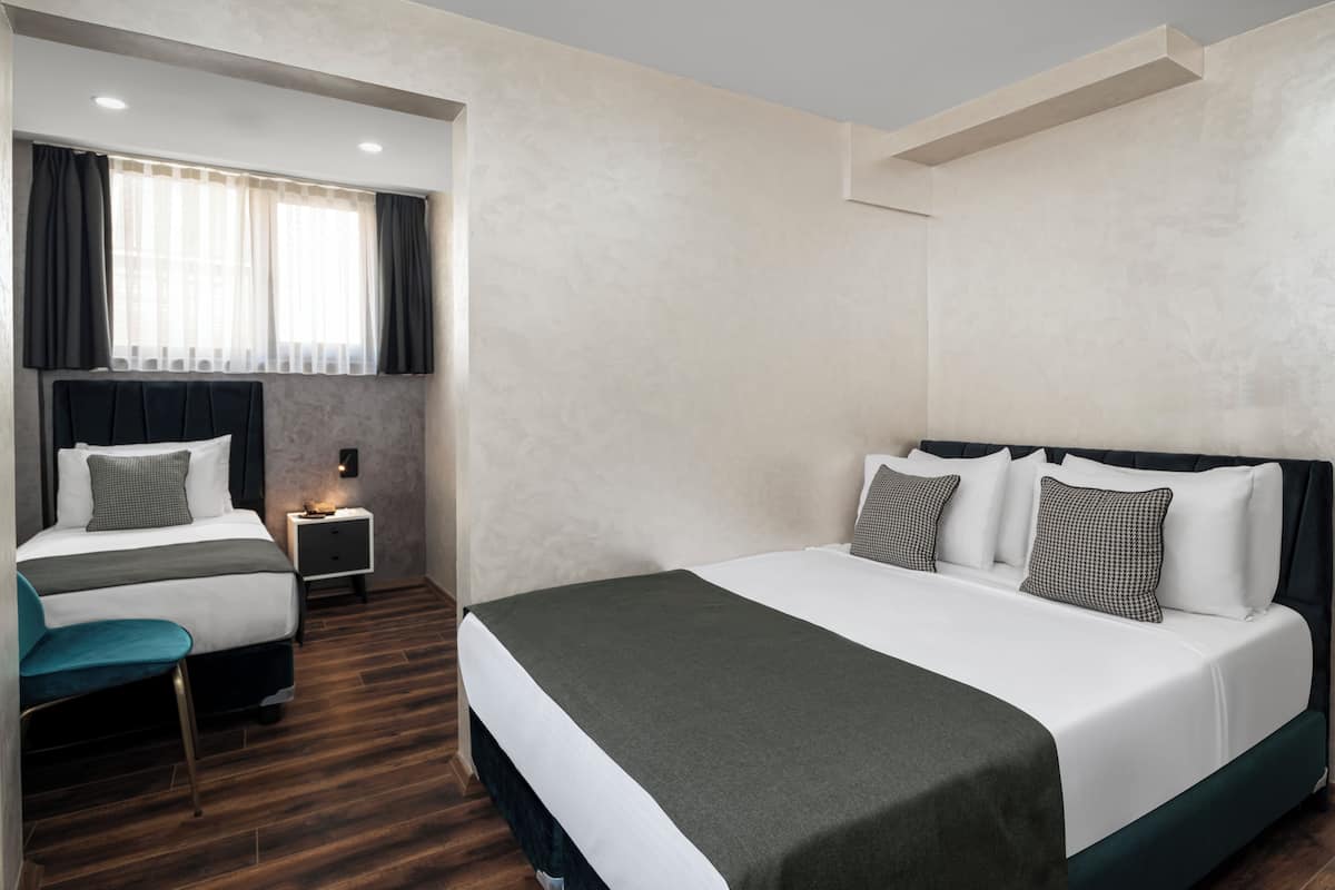 Economy-Dreibettzimmer | Hochwertige Bettwaren, kostenloses WLAN, Bettwäsche