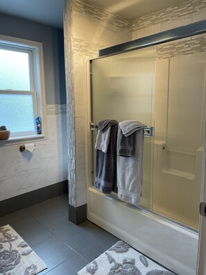Shower, hair dryer, towels, soap
