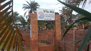 A sign for Villa Mia, indicating it is a self-catering holiday flat with fully serviced accommodations.