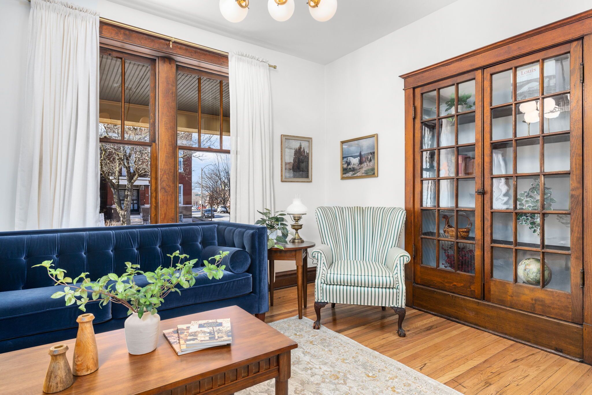 Living Room shows off beautiful built ins original to the home.