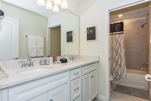 Shower, hair dryer, towels, toilet paper