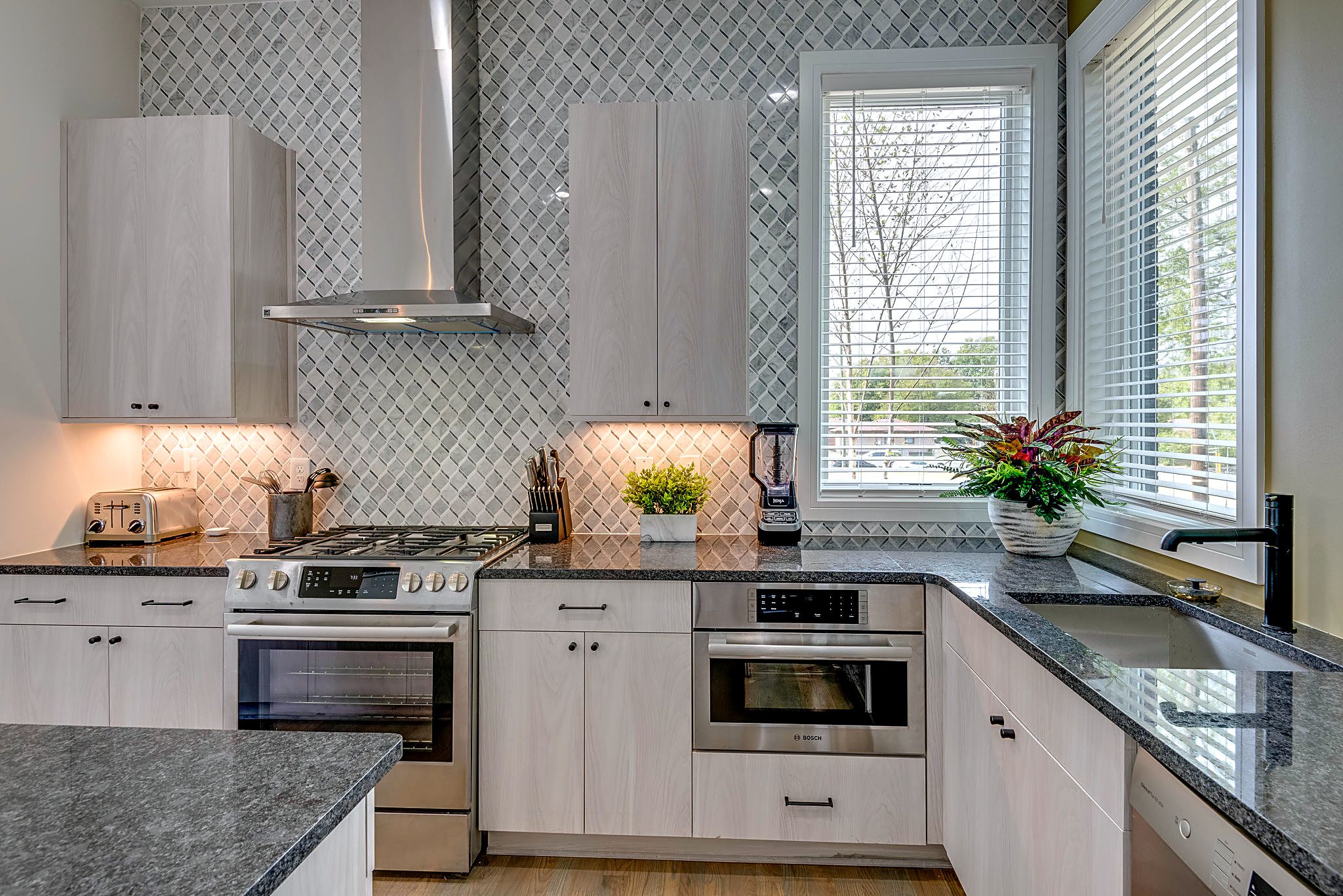 The heart of the home—a fully equipped kitchen with a massive island for group breakfasts and social hour.