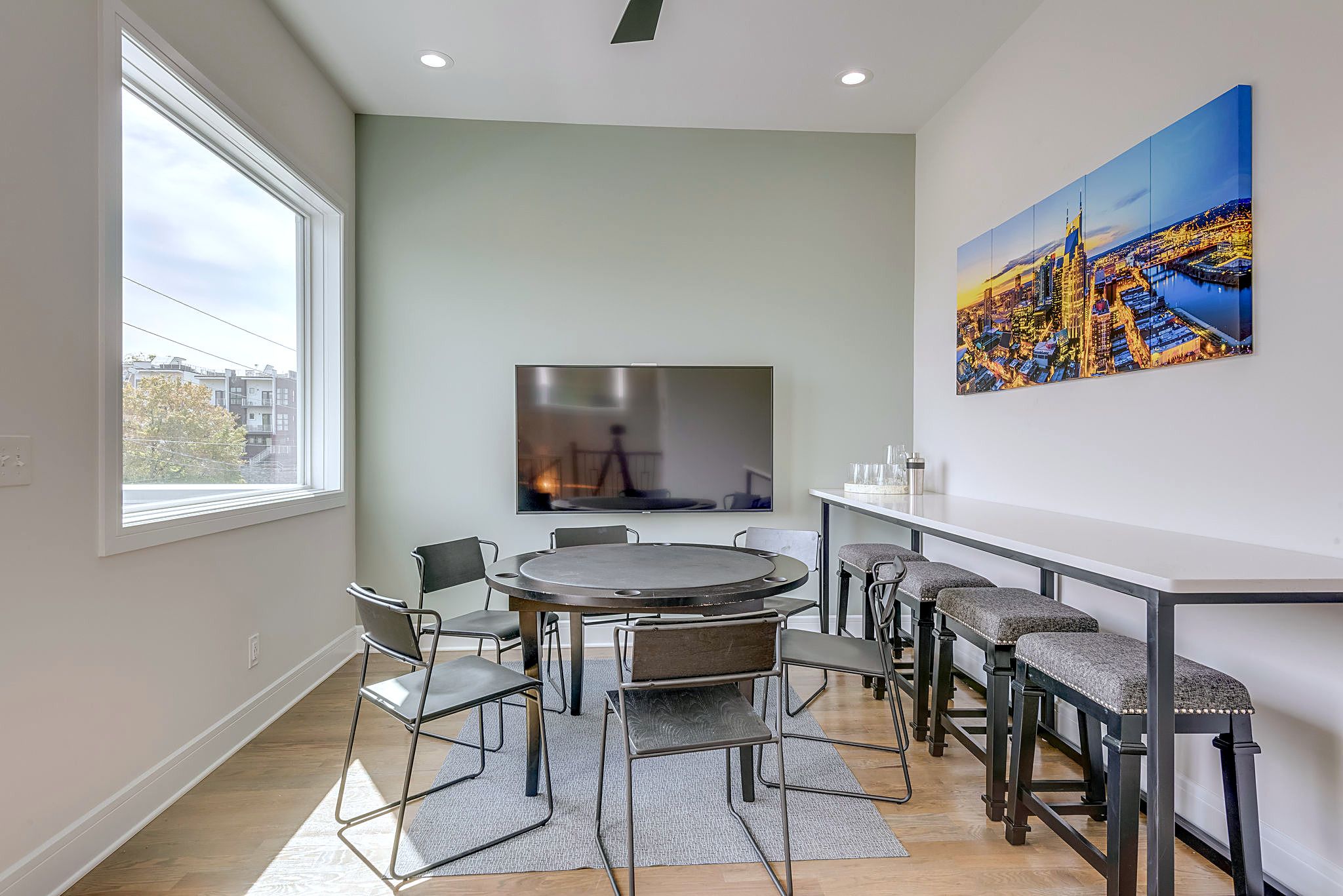 3rd Floor Entertainment Flex Space – Poker Table, Bar & 70" Smart TV for Game Day.