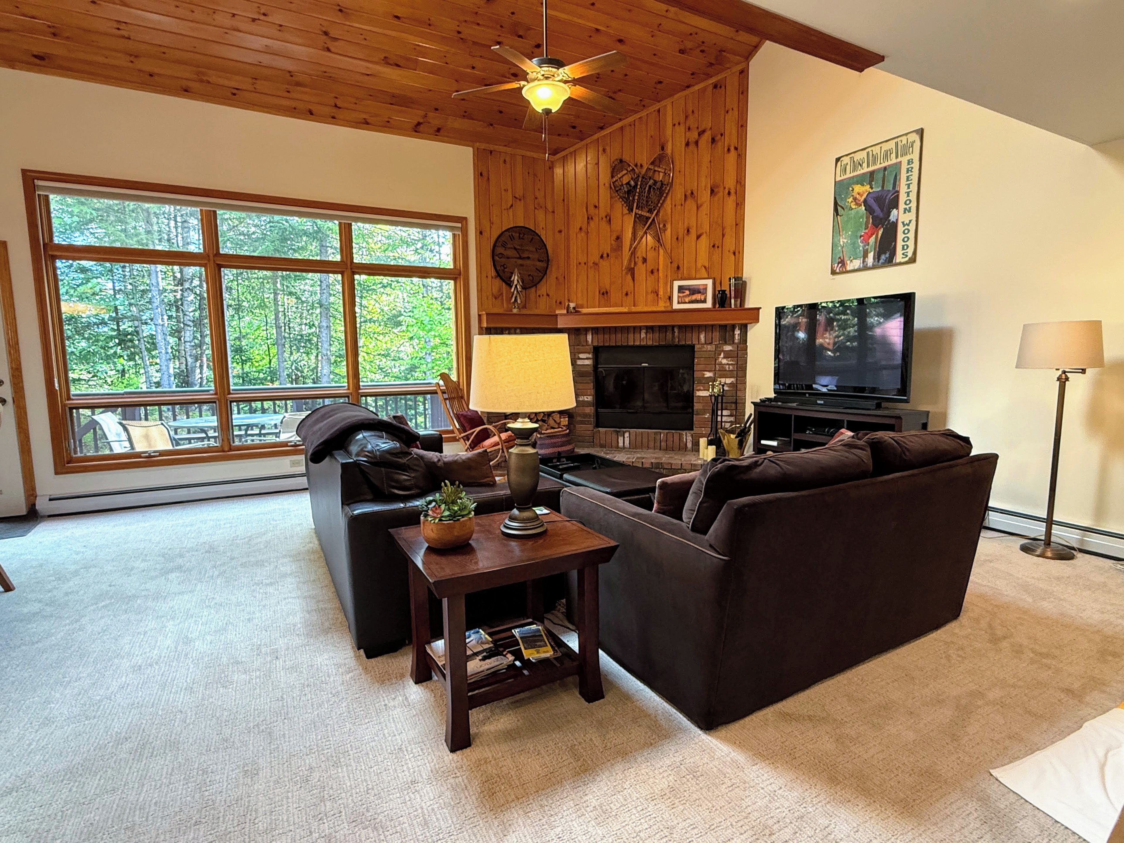 Main Level Living Area with Fireplace, TV and deck