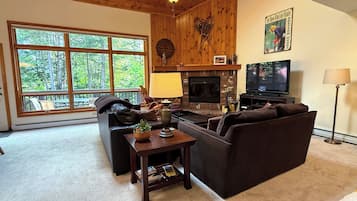 Main Level Living Area with Fireplace, TV and deck