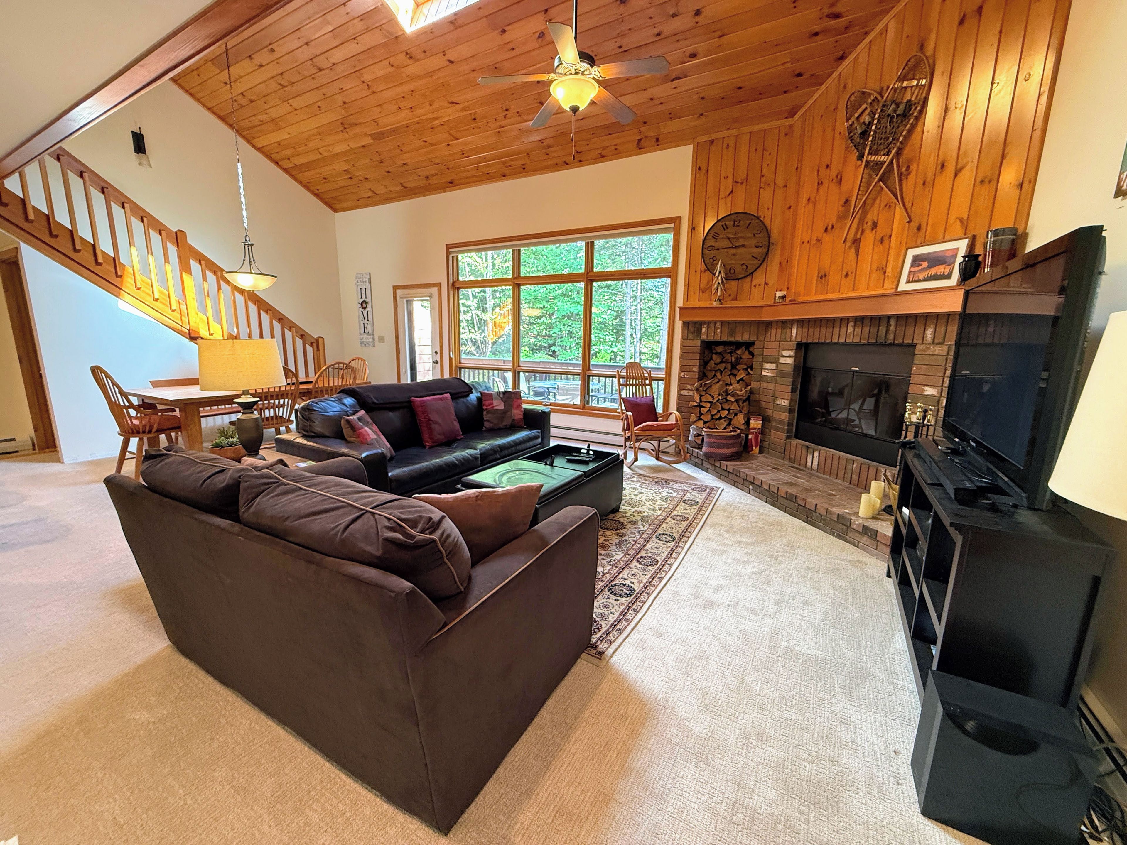 Main Level Living Area with Fireplace, TV and deck