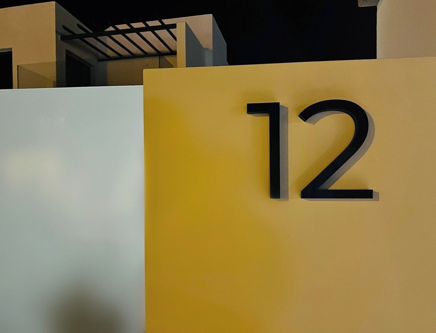 A yellow sign with the number 12.