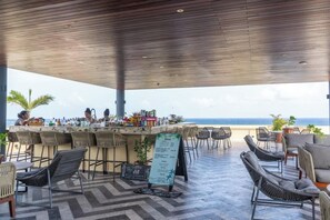 Shared rooftop dining with umbrella