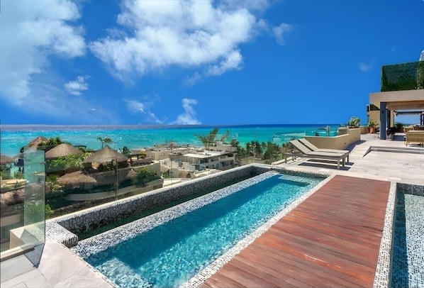 Shared rooftop pool with ocean views