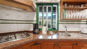 Fridge, microwave, stovetop, coffee/tea maker