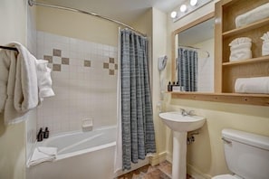 A bathroom with a bathtub, shower, sink, and toilet. - Silver Mill 8173-1br-walk To Slopes! Kids Ski Free! 1 Bedroom Condo by RedAwning (Keystone)