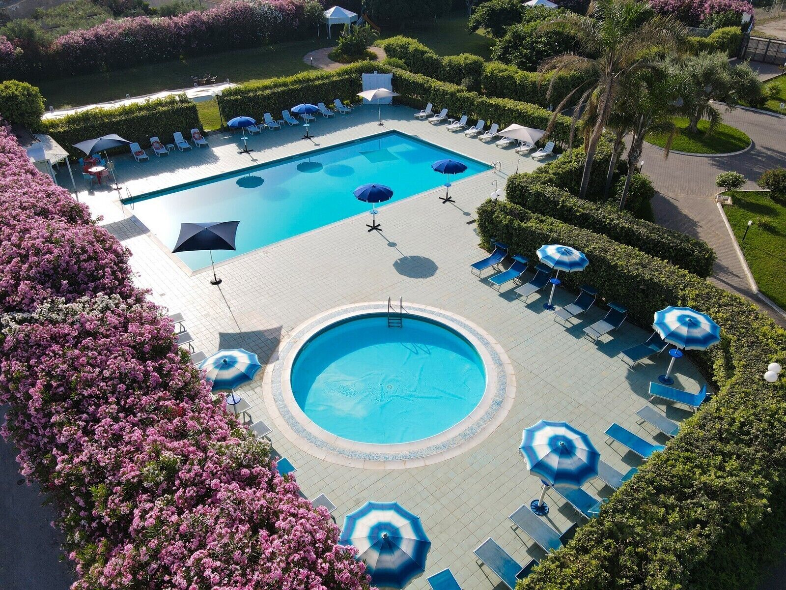 Seasonal outdoor pool, pool umbrellas, pool loungers