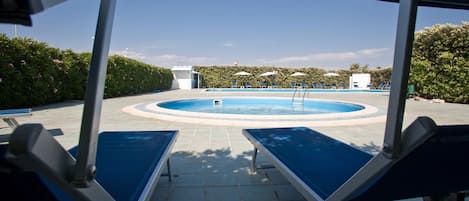Seasonal outdoor pool, pool umbrellas, sun loungers