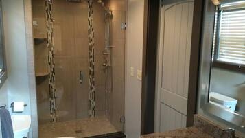 Shower, hair dryer, towels, toilet paper