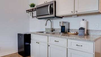 Microwave, coffee/tea maker, toaster, cookware/dishes/utensils