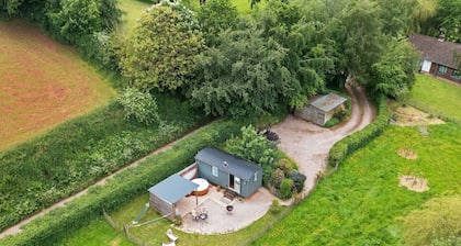 A shepherds hut that sleeps 2 guests  in 1 bedroom