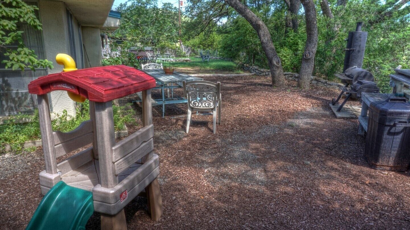 BBQ area by deck has a picnic table