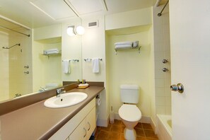 Combined shower/tub, hair dryer, towels, soap