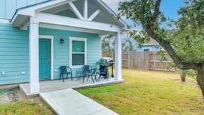 A house with a covered porch, a grill, and a small table and chairs. - 1 Mi to Beach: Retreat w/ Large Yard in Rockport (Rockport)