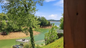 A riverside view with a dock, trees, and a clear sky. - 20% OFF NEW Dock, Pavilion, Hot Tub, Kayaks, Lakefront- Blue Heron Landing (Dandridge)