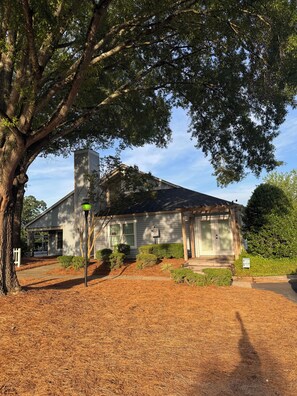 A single-story house with a covered porch, a chimney, and a 'No Parking' sign. - The Modern Hidden Gem 2BR 1bath with Balcony (Charlotte)