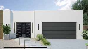 A modern two-story house with a large garage door, a number '456' sign, and a small garden with cacti. - Ultra modern contemporary Luxe (Palm Springs)