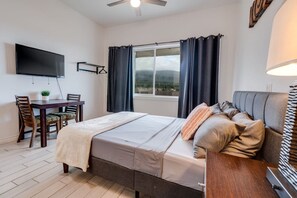 1 bedroom, desk, iron/ironing board, travel crib