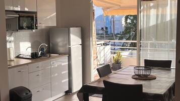 Fridge, microwave, stovetop, coffee/tea maker