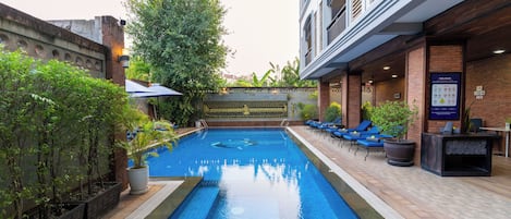 Outdoor pool, open 8:00 AM to 10:00 PM, pool umbrellas, pool loungers