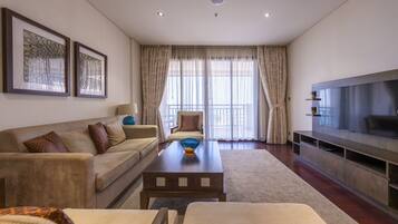 Luxury Apartment | Living area | 50-inch TV with cable channels