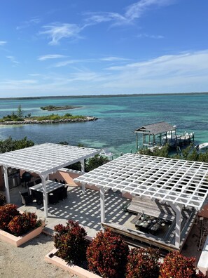 Outdoor dining - Unparalleled views in Abaco! Private 4 acre estate with beach, dock and cabana. (Little Harbour)