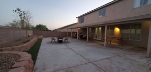 Enjoy a serene outdoor space with a patio, garden, and seating area.
