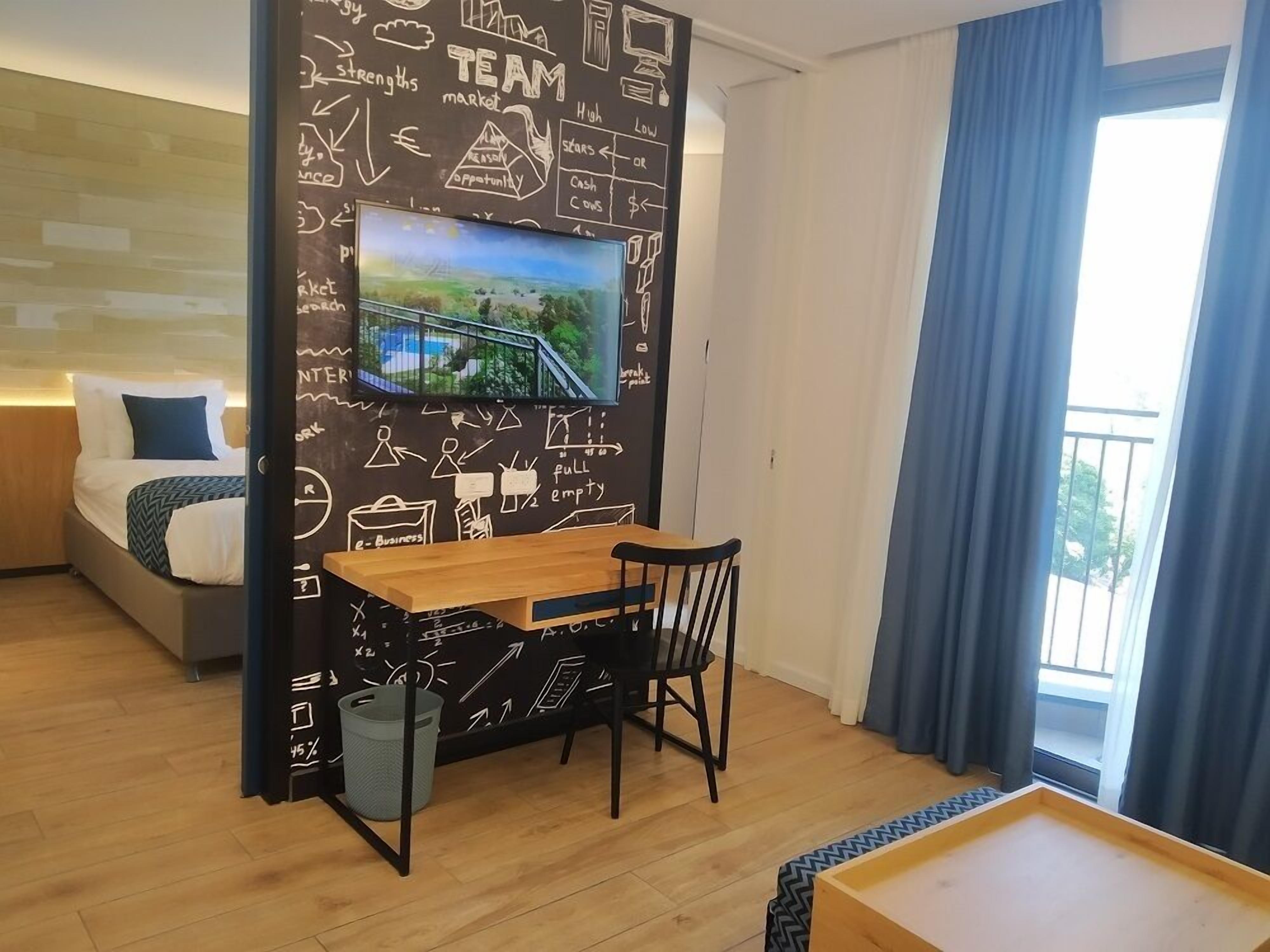 Executive Quadruple Room | In-room safe, iron/ironing board (on request), travel crib, WiFi (free)